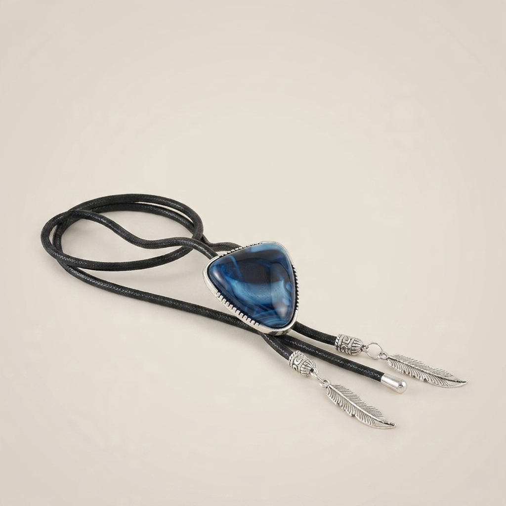 Close-up of green triangle crystal inlay pendant necklace showing detailed crystal texture