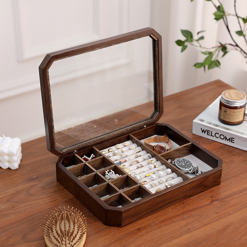 Top-down close-up of black walnut octagonal jewelry box with glass lid