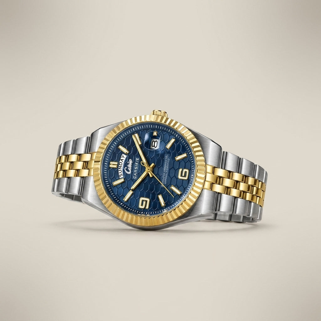 Two-tone stainless steel men’s watch with black dial top-down showing fluted bezel and bracelet detail lit
